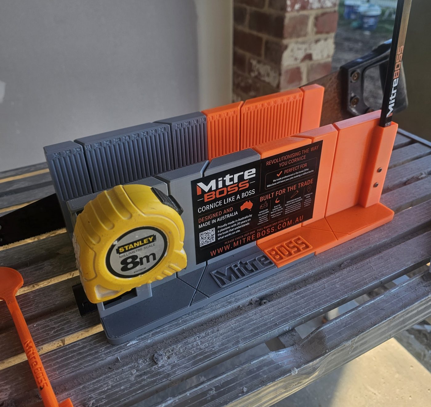 Mitre BOSS cornice mitre box on site with tape measure and pencil
